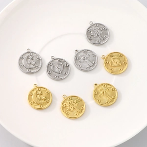 Detailed collection of gold and silver sun, moon and heart charms on a white plate