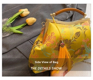 Detail view of yellow brocade qipao handbag with floral embroidery and wooden handle