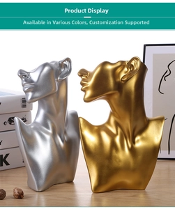 Detail showing elegant gold and silver resin bust stands for necklace and jewelry display
