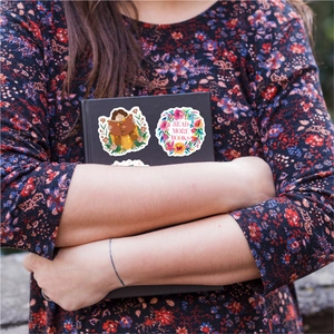 50 holographic floral book stickers featuring Read More Books text on a black notebook