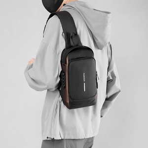 Detail of crossbody bag featuring anti-theft combination lock and USB charging port