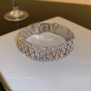 Sparkling silver wide cuff bracelet with multi-row rhinestone pavé and fold-over clasp