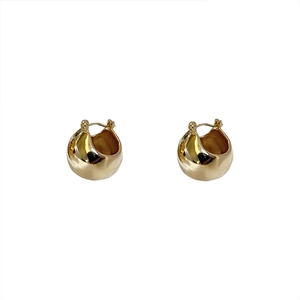 Minimalist thick gold hoop earrings with smooth metallic finish and secure clasp closure