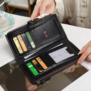 Women's black long bifold wallet with multiple card slots and secure metal zipper closure