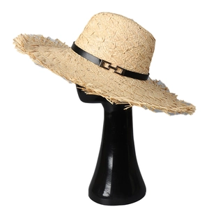 French style wide brim raffia sun hat with black belt and golden buckle on white background