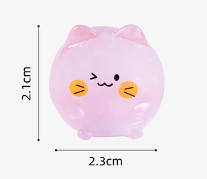 Close-up of pink mini cat figurine showing dimensions 2.1cm height and 2.3cm width