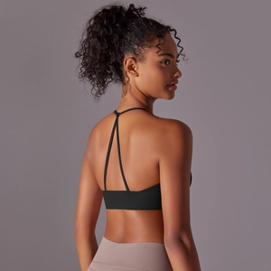 Detailed back view of a black Y-strap halter yoga bra with matte high-elasticity fabric