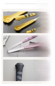 Detailed view of cat paw food tongs with stainless steel handles and anti-slip silicone tips