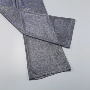 Close-up of the grey-blue sequin fabric texture and fine stitching on a 3-piece set