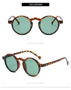 Detail view of round leopard print sunglasses with light green lenses and retro frame