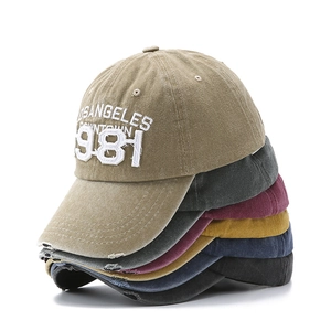 Detailed stack of six vintage washed cotton baseball caps with distressed brim and embroidery