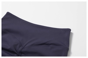 Close-up of high-waist yoga leggings featuring scrunch butt detail and matte fabric texture