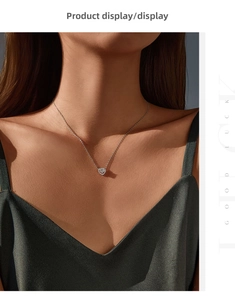 Detail of a 925 sterling silver hollow heart necklace with a floating round stone on a model
