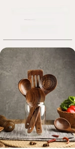 Close-up of teak wood kitchen utensils showing natural grain texture and hanging holes