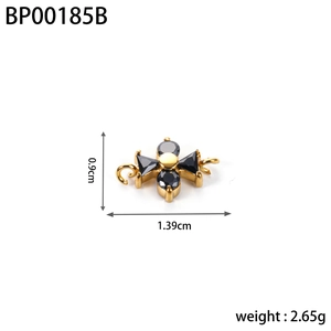 Detailed view of a gold cross pendant with black zircon insets and 1.39cm size