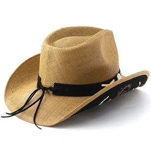 Detail of straw cowboy hat featuring black suede band and tribal print on the underbrim