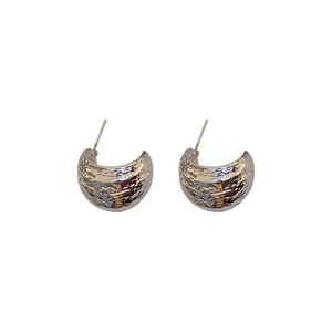 Silver geometric C-shape stud earrings with hammered texture and glossy metallic finish