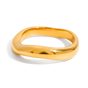 Close-up of golden irregular lava-style stainless steel ring with polished finish