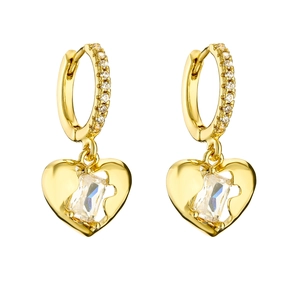 Detail of gold heart earrings with micro-paved zircons and a baguette-cut center stone