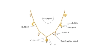 Detail view of gold star and moon necklace with freshwater pearl and size measurements