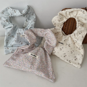Floral canvas wrist bags in blue, pink and white with elastic scrunchie handles