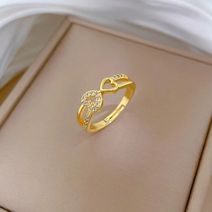 Adjustable gold plated ring with interlocking hearts and cubic zirconia accents