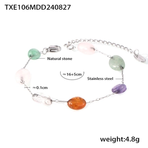 Detail of colorful natural stone beaded bracelet with stainless steel chain and logo tag