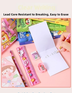 Close-up of pink 6-in-1 cartoon stationery set including ruler, eraser and notebook
