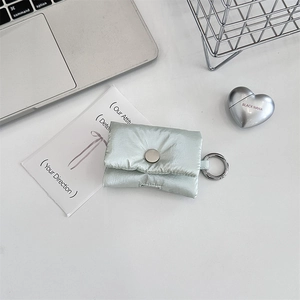 Detail of mint green quilted puffer style earphone case for AirPods with metal buckle