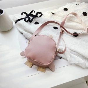 Detail of cute pink penguin PU leather kids bag with adjustable shoulder strap