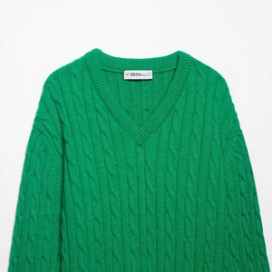 Green V-neck cable knit sweater for women with thick 8-ply chunky textured pattern