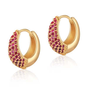Modern gold circular earrings with purple zircon pavé settings on white background
