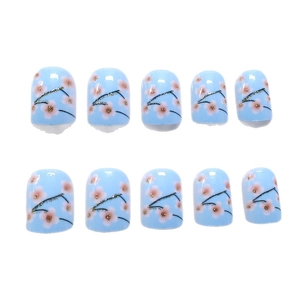Short oval light blue press-on nails with pink cherry blossoms and gold glitter accents