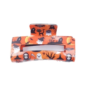 Halloween theme PVC hair claw clip with orange ghosts and bats pattern on white background