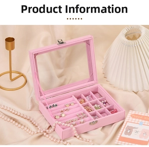 Pink velvet jewelry box with glass lid showing multi-grid ring and earring storage