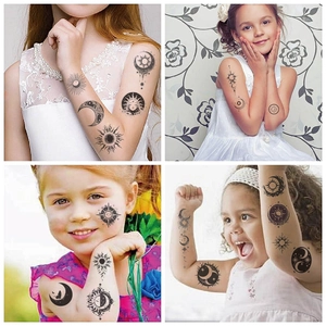 Detail of sun and moon temporary tattoos for kids featuring four distinct pattern designs