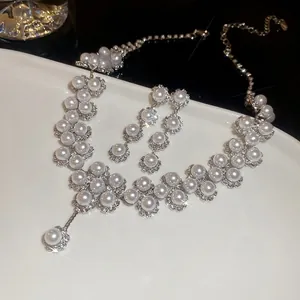 Elegant floral pearl necklace and earrings jewelry set with sparkling rhinestones details