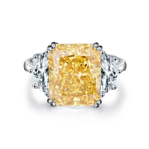 Radiant cut yellow diamond S925 silver ring with side crescent stones on white background
