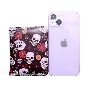 Short skull and spider web print wallet shown next to a smartphone for size reference