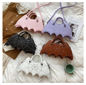 Five gothic bat-shaped PU leather handbags with spiderweb stitching in multiple colors