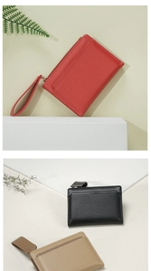 Close-up of saffiano leather wallets in red, black and khaki with metal zippers