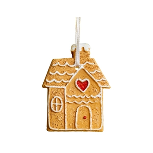 Gingerbread house Christmas ornament with red heart and white frosting on white background