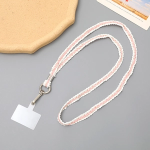 Pink and gold woven phone strap with silver clasp and transparent connector tab