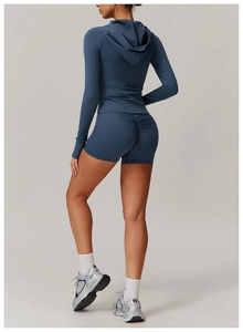 Rear view detail of scrunch butt yoga shorts and hooded jacket in morandi blue color