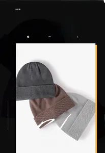 Detailed knit texture of three winter beanies in dark grey, brown, and light grey colors