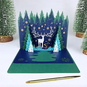 3D pop-up Christmas card with laser-cut forest deer scene and gold foil snowflakes