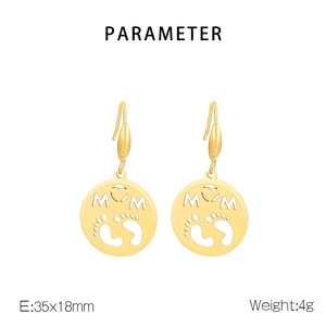Detail of gold MOM letter earrings with heart and baby footprints cut-out patterns