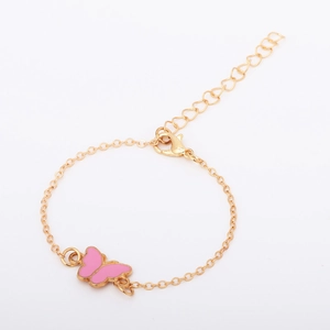 Close-up of pink enamel butterfly bracelet with golden adjustable chain and clasp