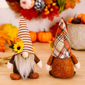 Autumn gnome figurines with sunflowers and maple leaves for Thanksgiving decoration