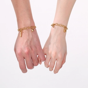 Golden stainless steel couple bracelets with magnetic heart charm and lock key pendant